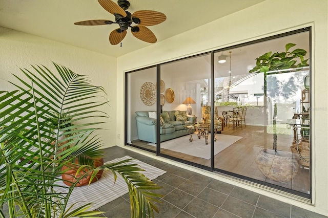 exterior space with a ceiling fan