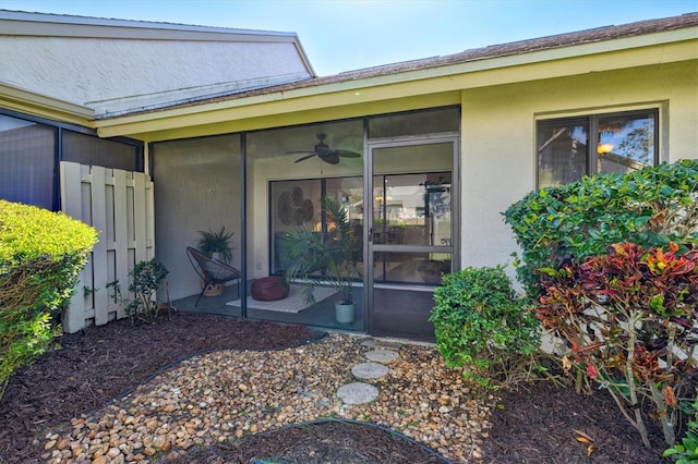 property entrance featuring stucco siding