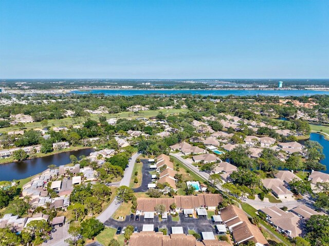 bird's eye view featuring a water view and a residential view