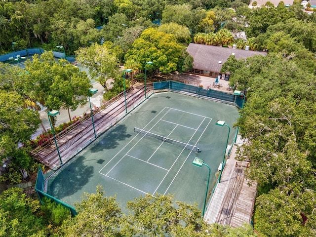 view of sport court featuring fence