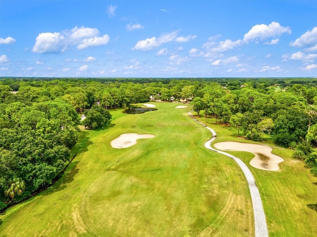 bird's eye view with golf course view and a forest view