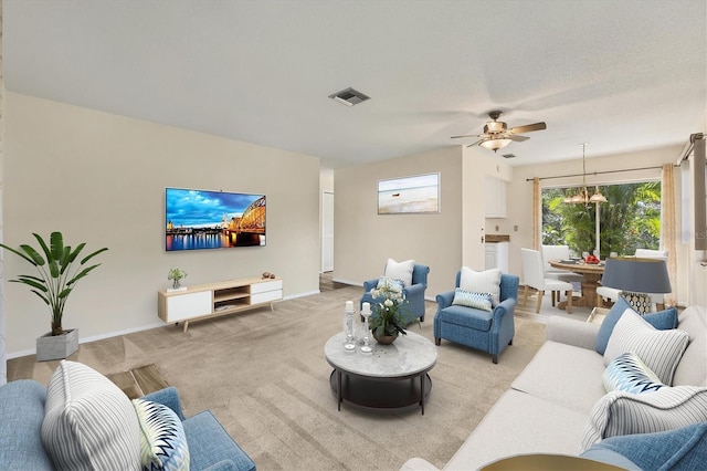 2267 Pueblo Ln Unit V40, Sarasota, FL 34231 - living room with ceiling fan, a chandelier, light colored carpet, and baseboards