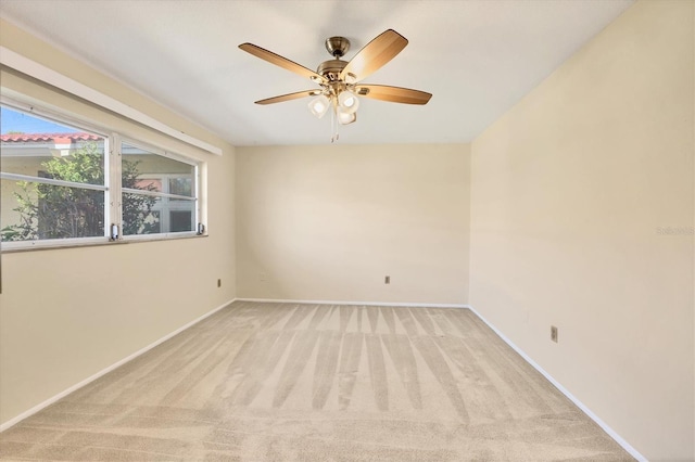 2267 Pueblo Ln Unit V40, Sarasota, FL 34231 - empty room with light carpet, ceiling fan, and baseboards