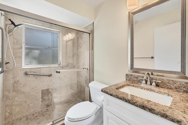 2267 Pueblo Ln Unit V40, Sarasota, FL 34231 - bathroom featuring toilet, a stall shower, and vanity