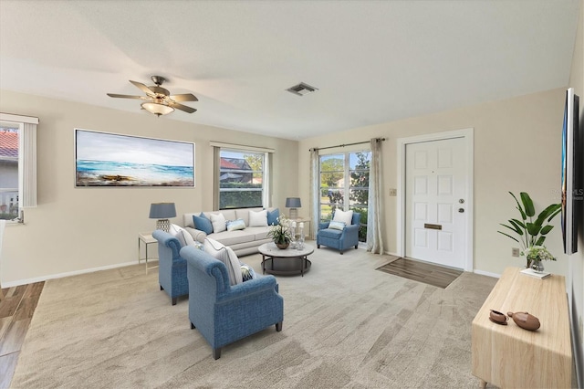 2267 Pueblo Ln Unit V40, Sarasota, FL 34231 - living area featuring ceiling fan, carpet flooring, and baseboards