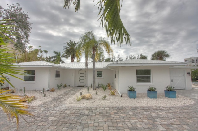 306 Island Cir, Sarasota, FL 34242 - rear view of house featuring stucco siding