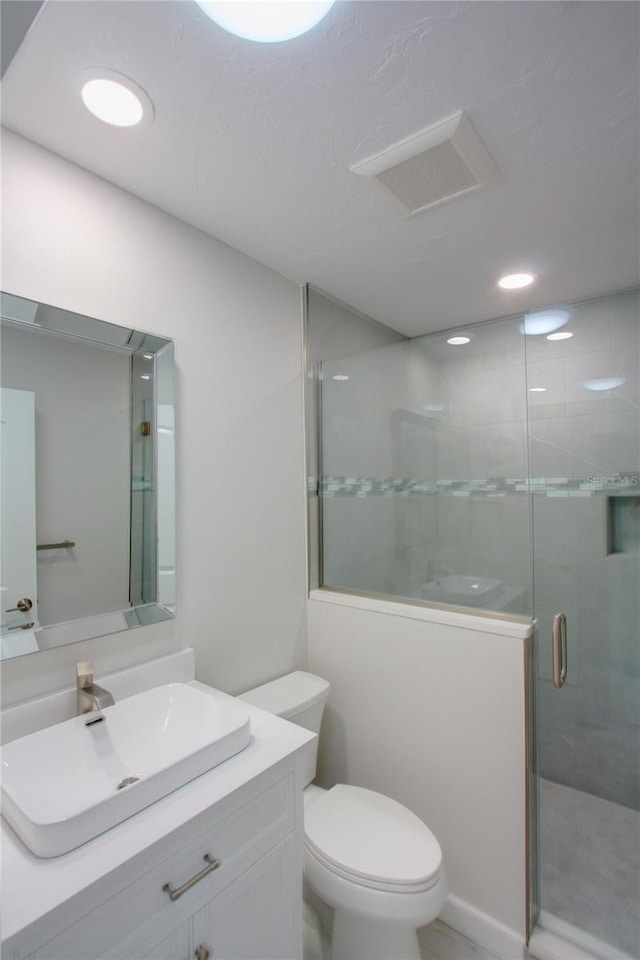 306 Island Cir, Sarasota, FL 34242 - full bath featuring visible vents, toilet, a stall shower, and vanity