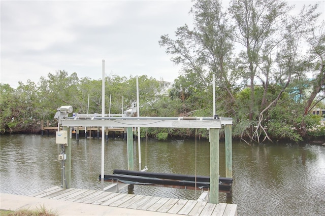 306 Island Cir, Sarasota, FL 34242 - view of dock with boat lift and a water view