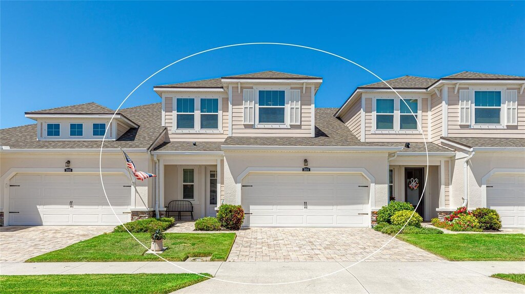 3684 Fescue Ln, Sarasota, FL 34232 - view of front of property with roof with shingles and decorative driveway