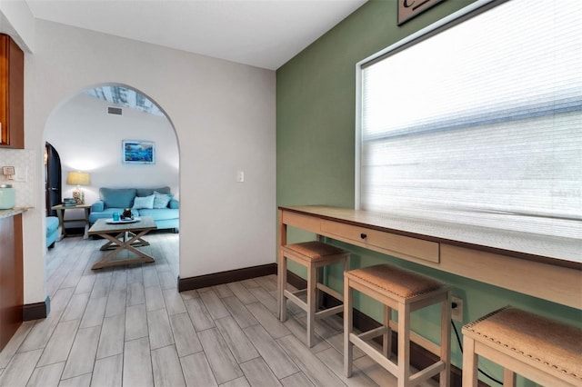 23088 Allen Ave, Port Charlotte, FL 33980 - home office featuring arched walkways and light wood-type flooring
