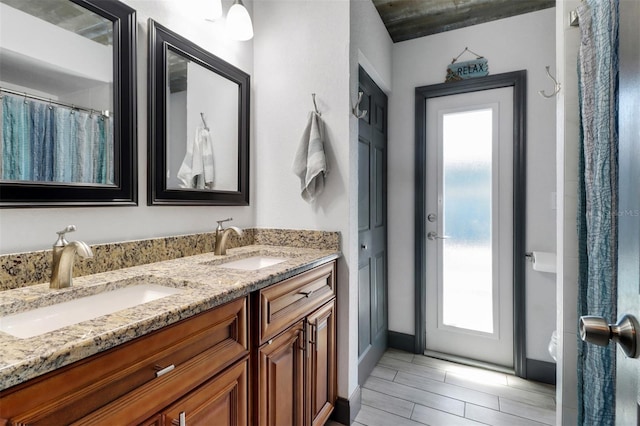 23088 Allen Ave, Port Charlotte, FL 33980 - full bath with double vanity and wood tiled floors
