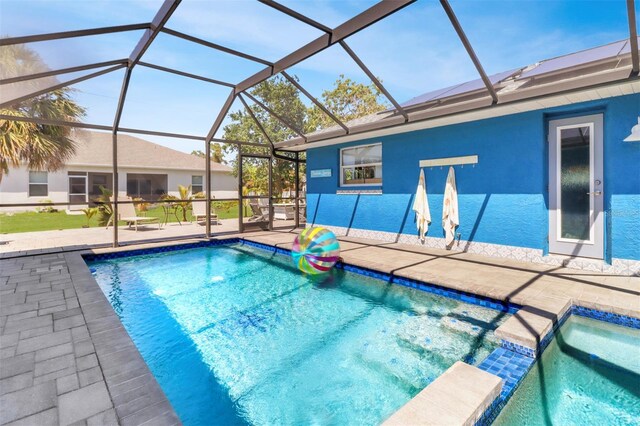 23088 Allen Ave, Port Charlotte, FL 33980 - view of pool featuring a patio area, a lanai, and a pool with connected hot tub