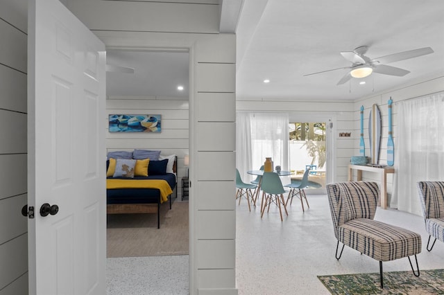 interior space with recessed lighting, speckled floor, and ceiling fan