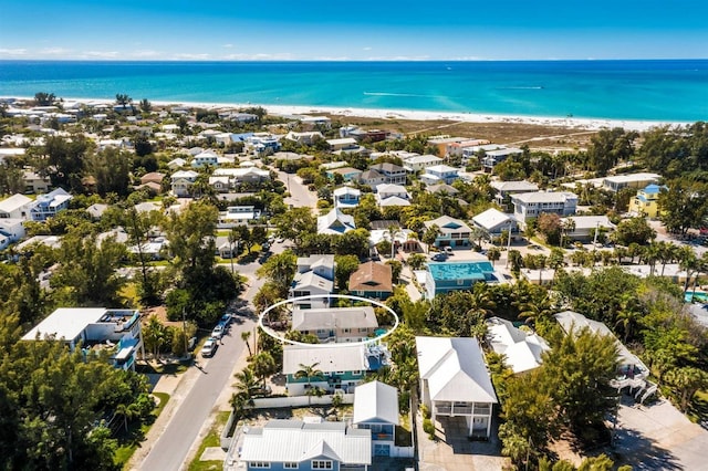 bird's eye view featuring a water view, a residential view, and a view of the beach