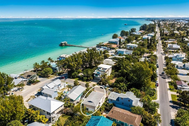birds eye view of property with a water view and a residential view