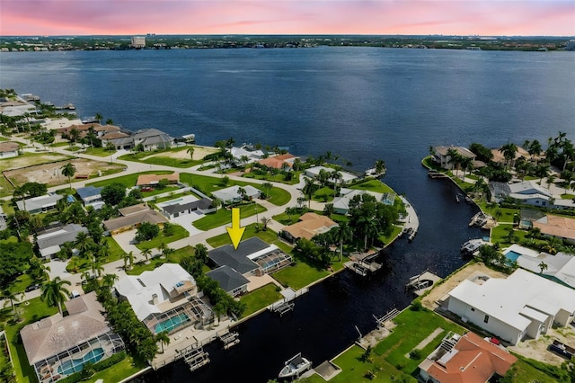 bird's eye view with a water view and a residential view