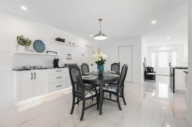 dining room featuring bar, recessed lighting, and marble finish floor