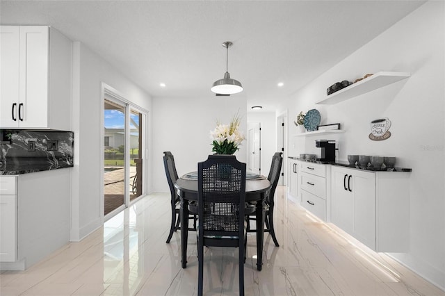 dining room with marble finish floor and recessed lighting