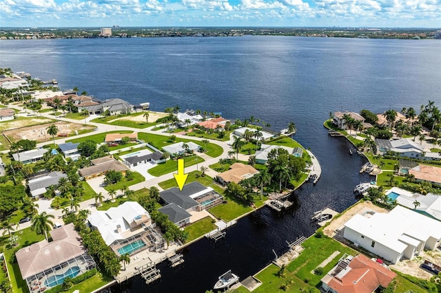drone / aerial view featuring a residential view and a water view