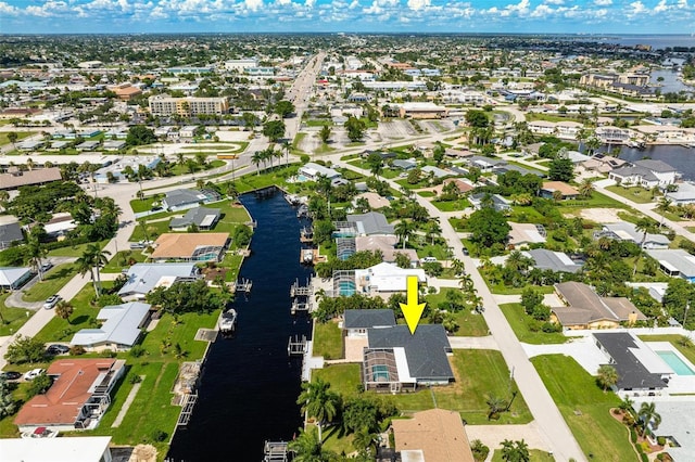 bird's eye view featuring a water view and a residential view