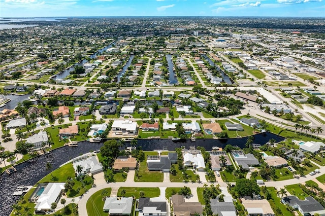 aerial view featuring a residential view and a water view