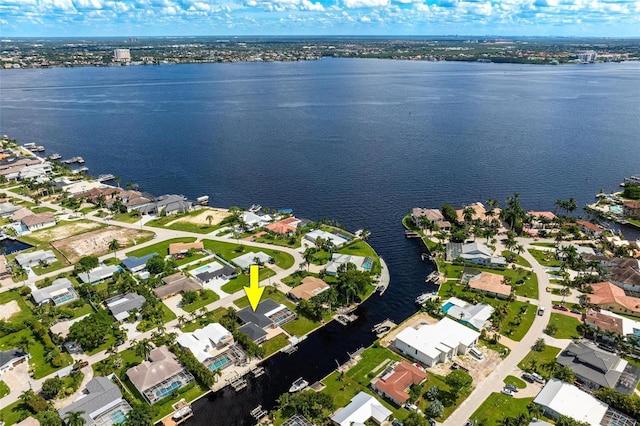 aerial view with a residential view and a water view