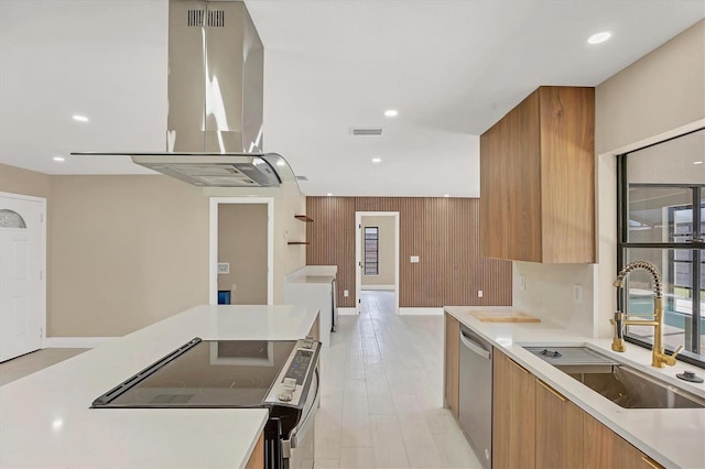 kitchen with stainless steel dishwasher, a sink, visible vents, modern cabinets, and electric range oven