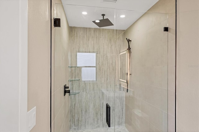 full bath with recessed lighting and a shower stall