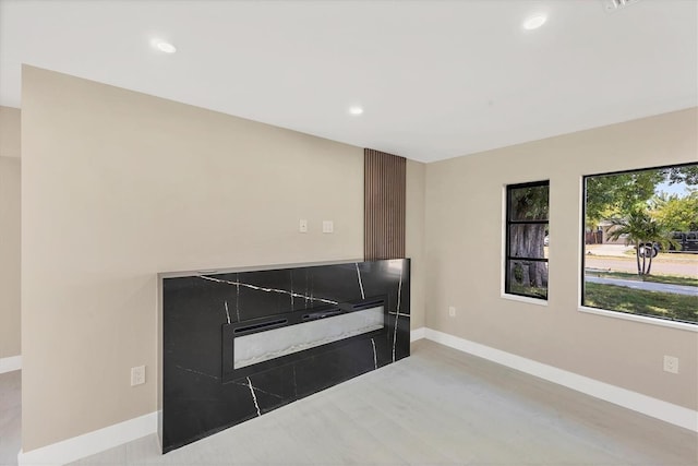 interior space with baseboards and recessed lighting