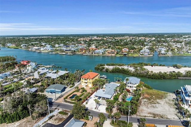 drone / aerial view featuring a water view and a residential view