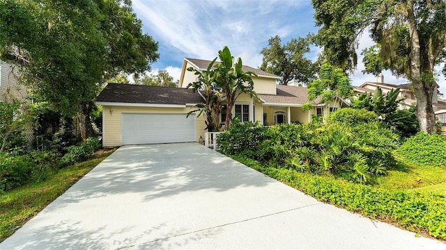 view of front facade with driveway and a garage