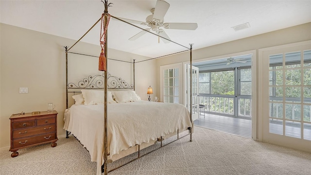 bedroom with carpet, access to exterior, a ceiling fan, and visible vents