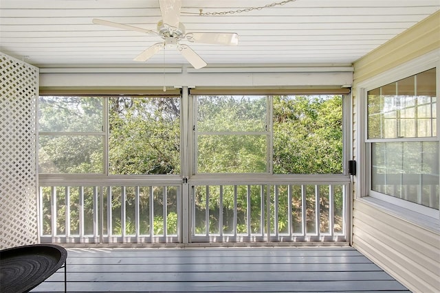 unfurnished sunroom with plenty of natural light and ceiling fan