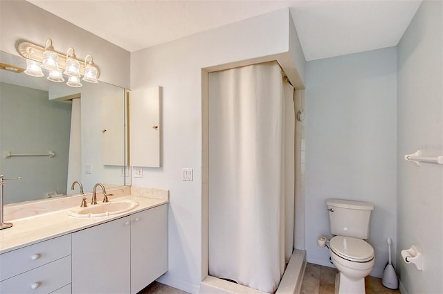 bathroom featuring toilet, vanity, and a shower with curtain