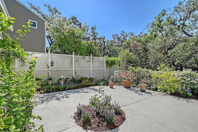 view of patio / terrace featuring fence