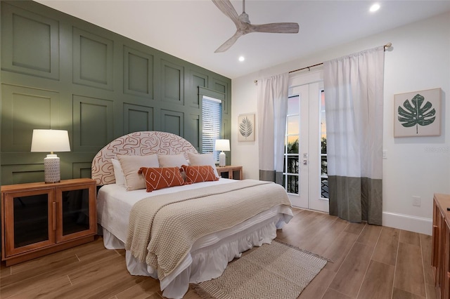 bedroom featuring baseboards, recessed lighting, french doors, light wood-style flooring, and access to outside