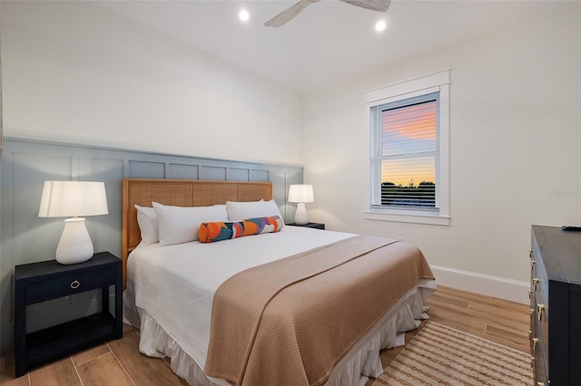 bedroom with light wood-type flooring, a ceiling fan, and recessed lighting