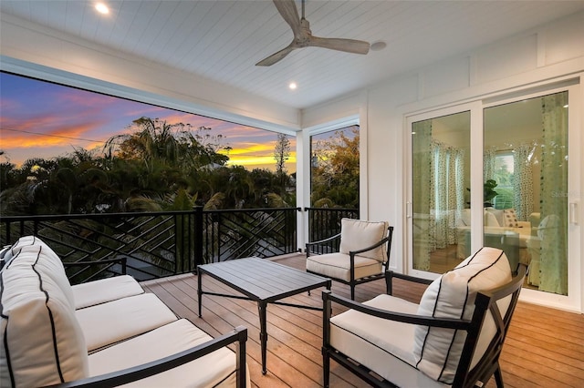 exterior space featuring an outdoor living space and a ceiling fan