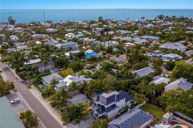 birds eye view of property with a water view and a residential view