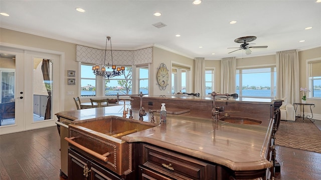 kitchen with recessed lighting, visible vents, ornamental molding, and french doors