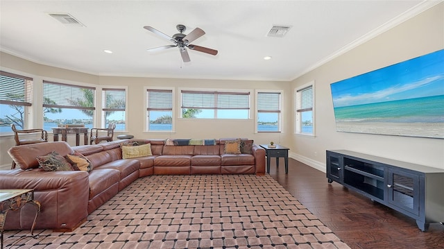 living area with ceiling fan, ornamental molding, wood finished floors, and visible vents