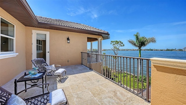balcony featuring a water view