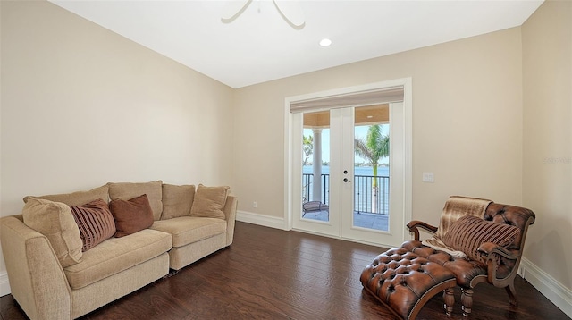 living room with dark wood-style flooring, baseboards, and recessed lighting