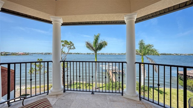 balcony featuring a water view