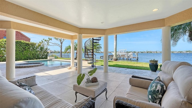 view of patio with stairway, a water view, a pool with connected hot tub, and an outdoor living space
