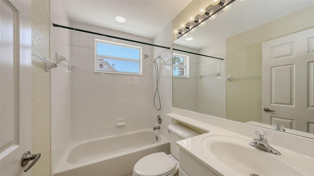 full bath with shower / bathtub combination, toilet, and vanity