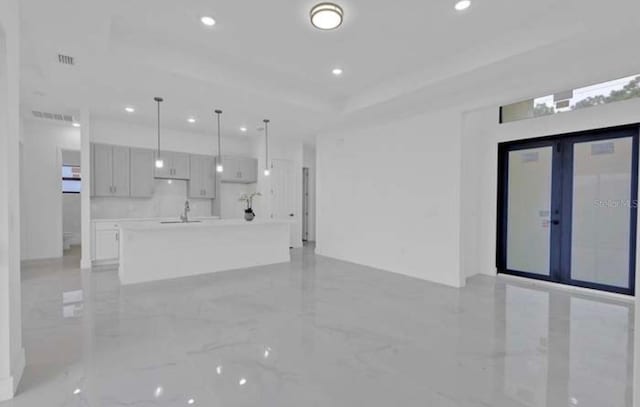 empty room with recessed lighting, marble finish floor, and a sink