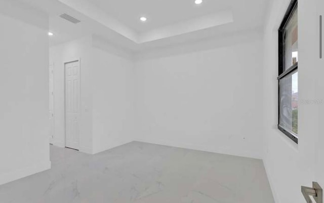 spare room featuring recessed lighting, marble finish floor, and visible vents