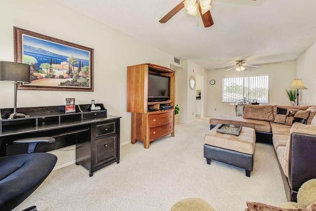 living room featuring a ceiling fan, light colored carpet, and baseboards