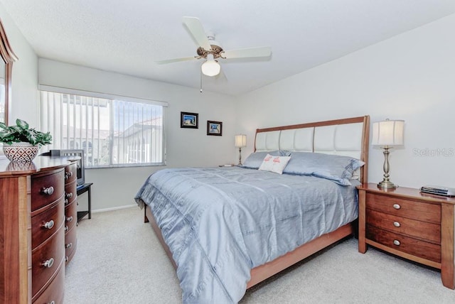 bedroom featuring carpet floors, ceiling fan, and baseboards